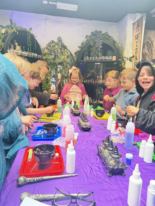 A room full of children brewing potions