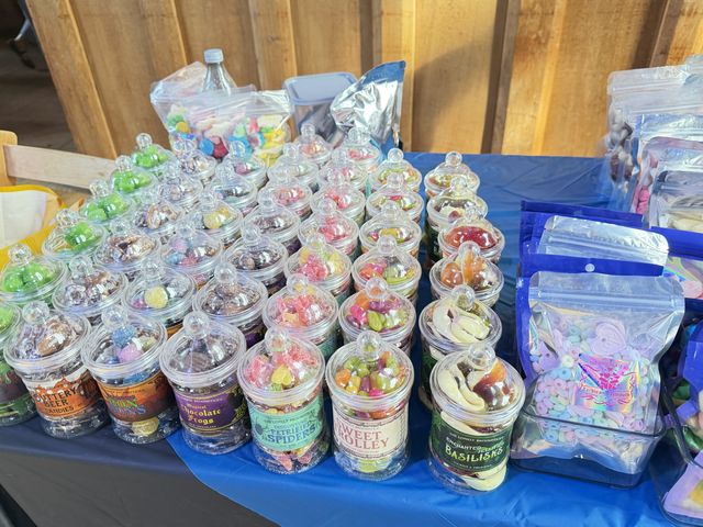 Jars of party sweets lined up on the table