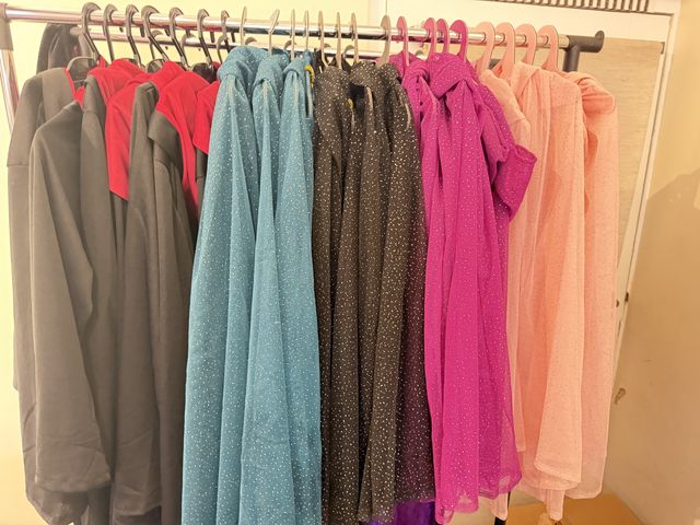 A rail of capes and cloaks ready for dressing up