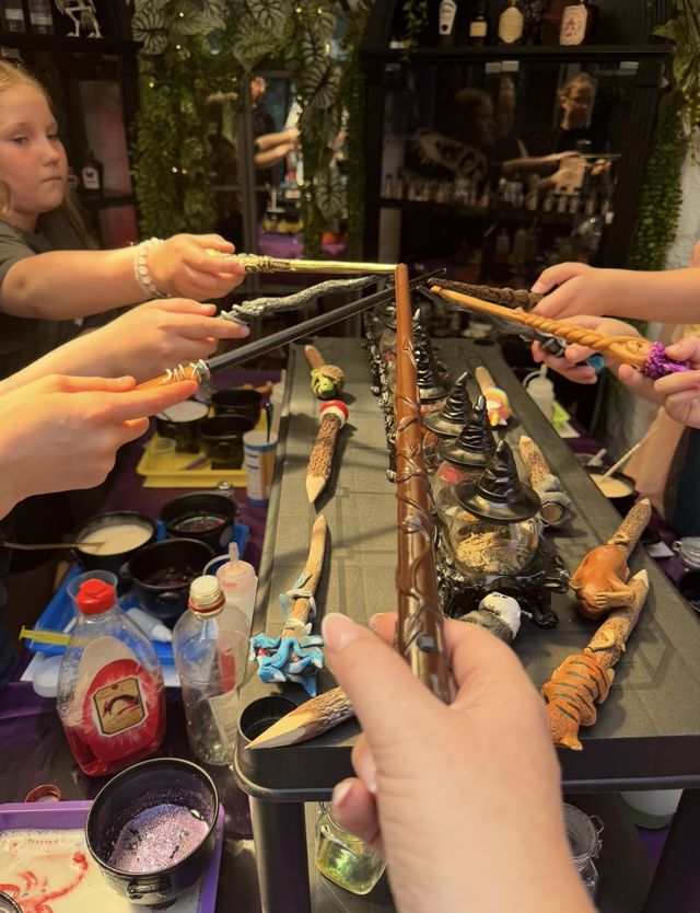 Wands crossed over the cauldrons