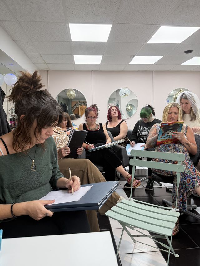 Guests concentrating on their life drawings