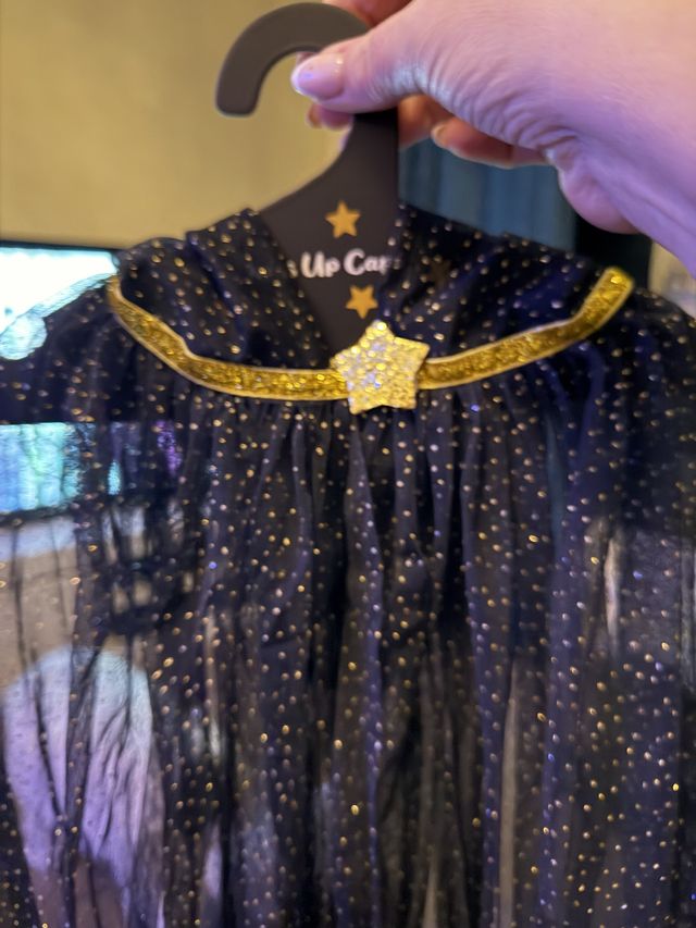 A starry cape with a gold collar