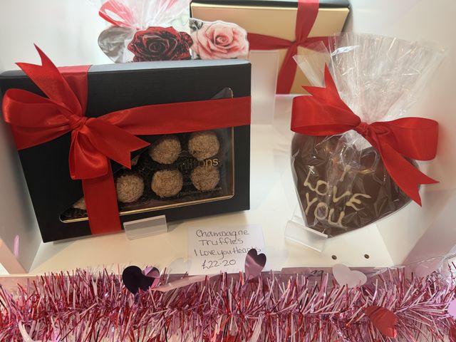 Chocolate truffle gift boxes tied with red ribbon