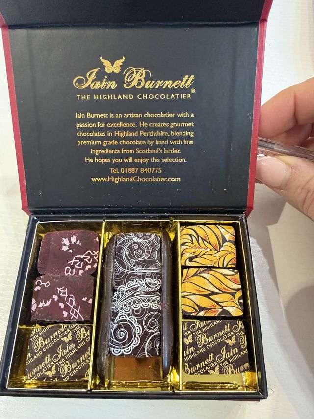 A box of tasting chocolates being opened